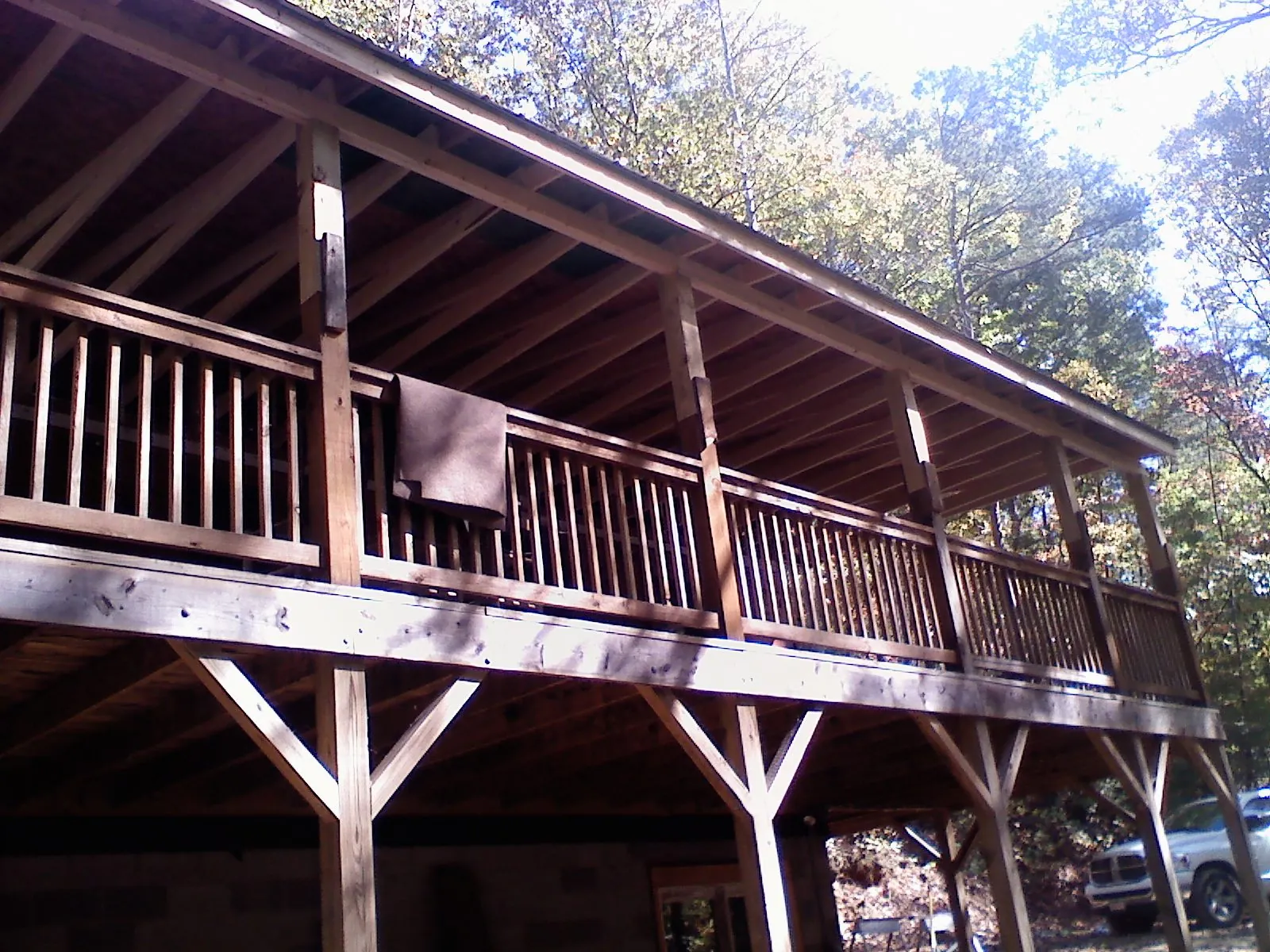 Timber framing under a new elevated porch and deck — Roof Leak Repair in Comer by Roofing Brothers